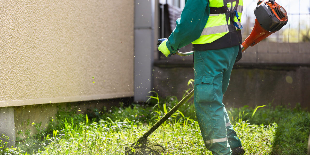 Commercial lawn maintenance worker finishing a job with high quality egger.